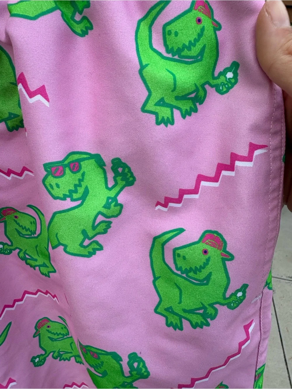 Tipsy Elves Men’s Pink Swim Shorts with Green Dinosaur Print- size M